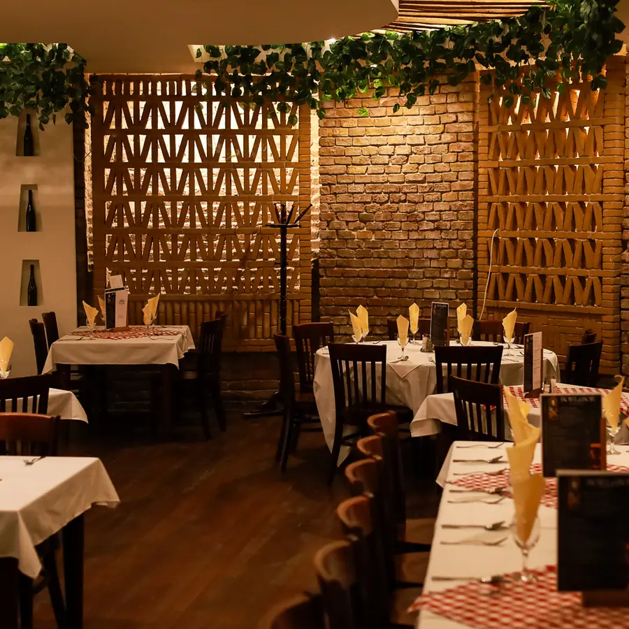 Brick dining hall set for guests