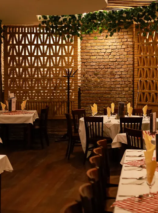 Set tables in the brick dining room