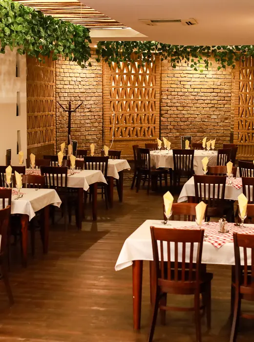Candlelit dining room with brick walls at Borlabor Restaurant, Budapest