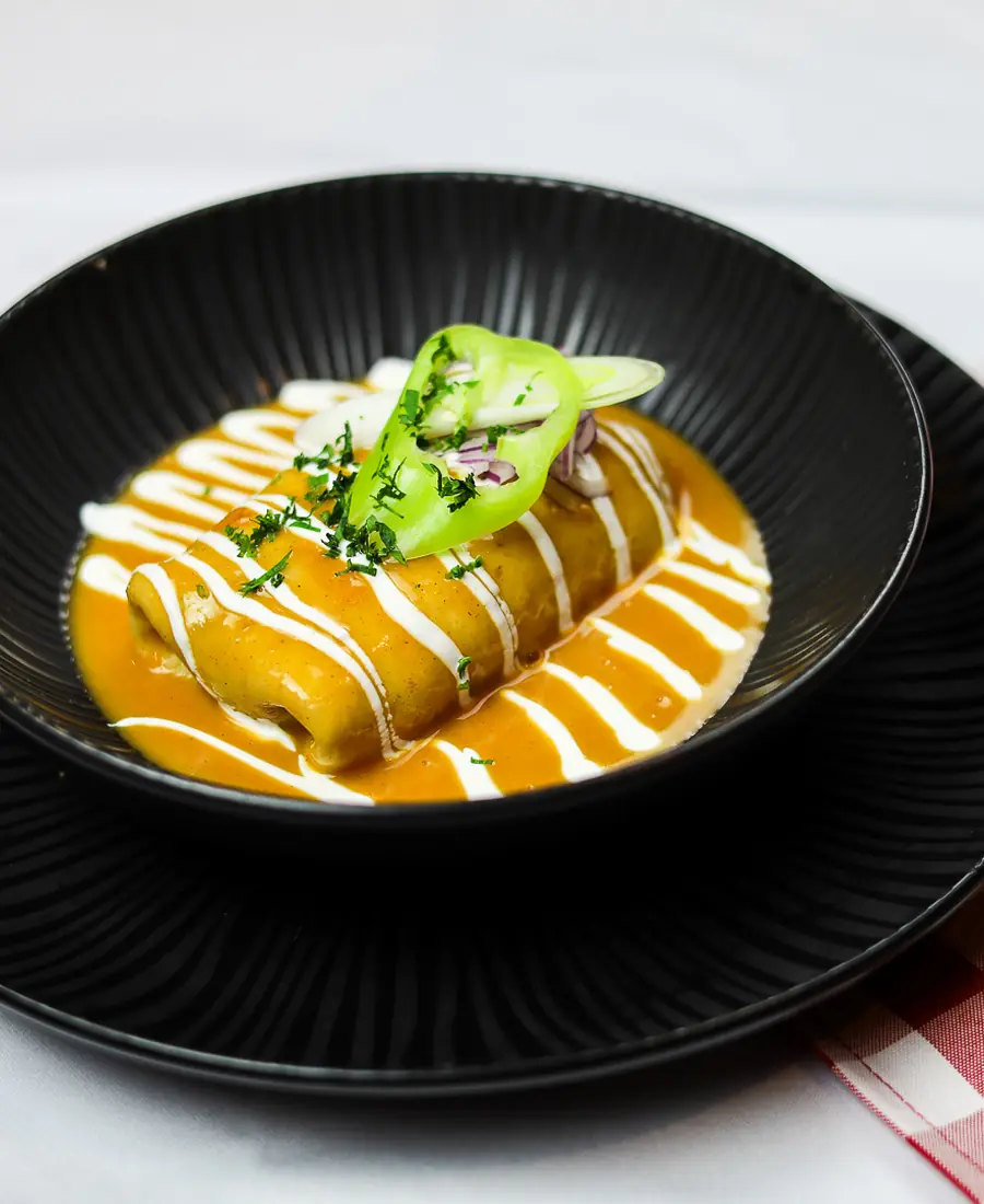 Hortobágyi palacsinta — Hungarian meat pancake in paprika sauce at Borlabor Budapest